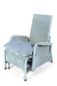 A vintage Lloyd Loom reclining wicker armchair in blue finish.