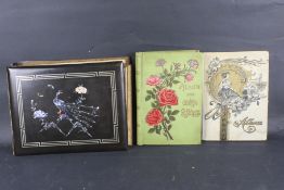 Two early 20th century postcards albums, France and Barcelona.