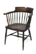 An oak and elm smokers bow elbow chair.