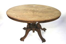 An early 20th century inlaid mahogany loo table.