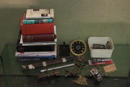 An assortment of watch and clock tools, components and books.