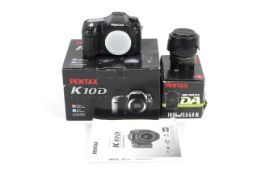 A Pentax K10D digital SLR camera and a SMC Pentax-DA 1:3.5-5.6 18-55mm lens.