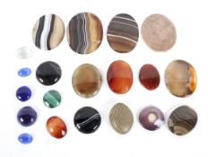 Twenty loose cut gemstones.