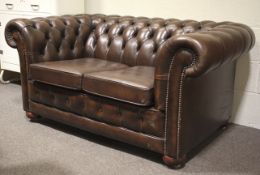 A modern Chesterfield two person settee.