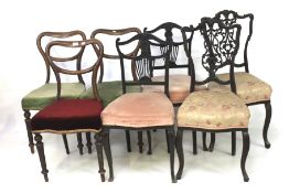 Seven assorted Victorian dining chairs.