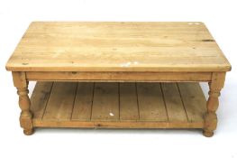 A contemporary pine coffee table.