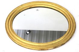 A vintage gilt framed wall mirror.
