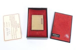 A boxed Dupont gold plated pocket lighter.
