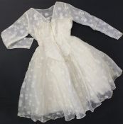 A vintage 1960s wedding dress ball gown. With flower embroidered decoration, boxed.