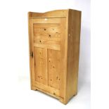 A contemporary pine cupboard. With single door and three fixed shelves inside. L81 x D39 x H145cm.