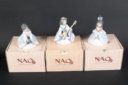 Three Nao oriental porcelain figures.