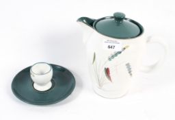 A Denby 'Greenwheat' mid-century coffee pot, matching egg cup and a saucer.