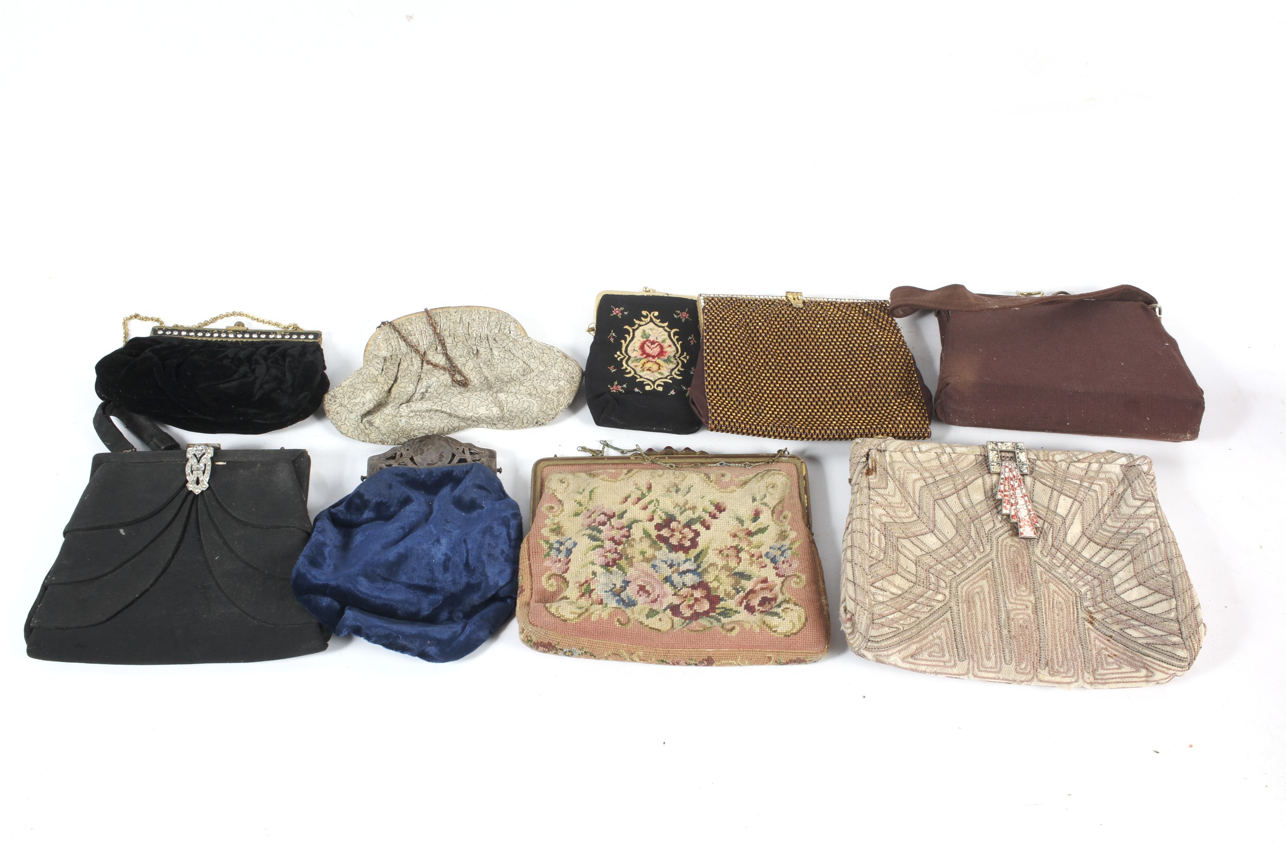 Nine vintage ladies handbags.