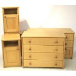 A set of five matching items of beech effect bedroom furniture.