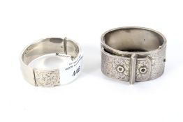 Two silver hinged bangles.