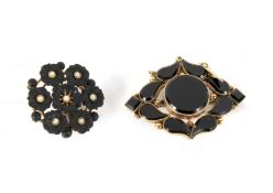Two Victorian yellow-metal and jet mounted mourning brooches.