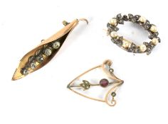 Three antique brooches.