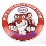 A reproduction enamel 'Esso Extra' sign.