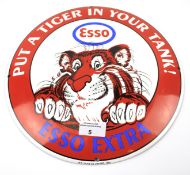 A reproduction enamel 'Esso Extra' sign.