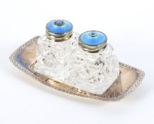 A David Anderson white metal tray with a pair of salt and pepper shakers.