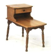 A mid-century Cambridge light oak two tier telephone table with small drawer.