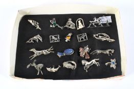 A collection of silver and white metal animal brooches.