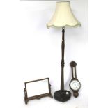A standard lamp, mirror and a barometer.