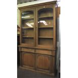 A 20th century light oak glazed display cabinet.