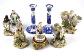 Five assorted 19th century ceramic figurines and a pair of Copeland Spode's Italian candlesticks.
