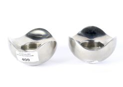 A pair of contemporary Georg Jensen Denmark candle holders.