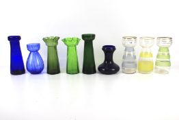 Nine assorted vintage glass bulb vases.