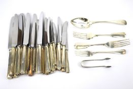 A set of Josph Rogers knives and an assortment of flatware.