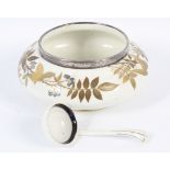 A late Victorian Royal Worcester 'Longton Hall' silver mounted Aesthetic Movement bowl and a ladle.
