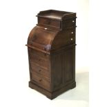 A small contemporary hardwood roll top bureau with drawers.