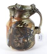 A studio art pottery jug signed D. Annette and dated '92 to the base.