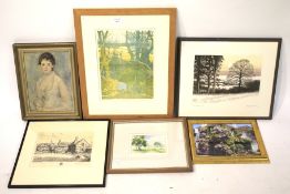 A group of framed landscape prints and watercolours.