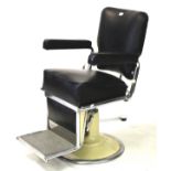 A La Reine Restocrat vintage barbers chair with cream enamel hydraulic base.