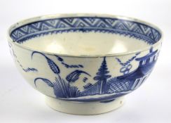A Staffordshire pearlware blue and white chinoiserie bowl, circa 1800.