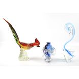 A contemporary glass vase and two glass figures of birds.