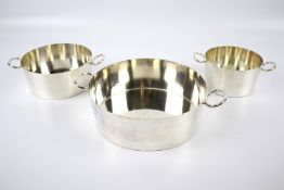 A graduated set of three silver-plated Hukin and Heath two-handled pans.