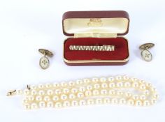 A saltwater pearl necklace, pair of gilt cufflinks and a tie pin.