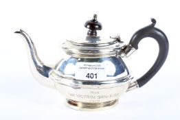 An early 20th century silver teapot.