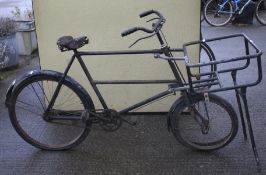 A vintage butcher's bike. Front basket holder and stand with push rod brakes, 23 inch frame no.