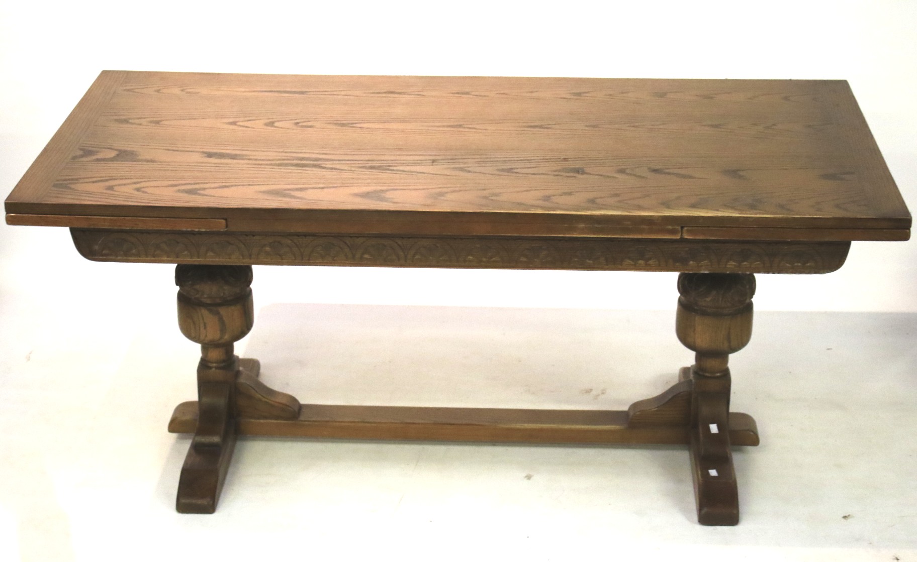 A 20th century oak draw leaf rectangular dining table.