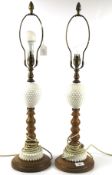 A pair of beech and opaline dimple glass table lamps.