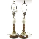 A pair of beech and opaline dimple glass table lamps.