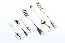 Six pieces of silver flatware.