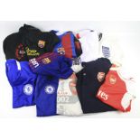 Twelve contemporary football shirts and sweatshirts.