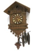 A traditional 20th century Swiss cuckoo wall clock.