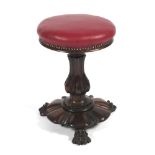 A William IV rosewood revolving piano stool, circa 1840.